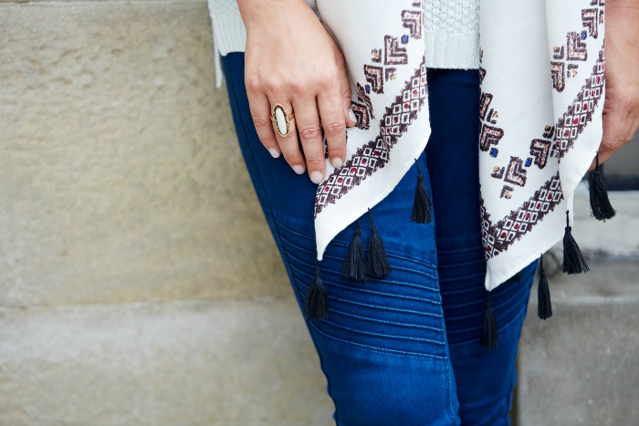 A long scarf and coordinating ring dress up the most basic knit and jeans